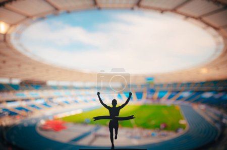 Foto de Champion 's Triumph: Silhouette of Runner Conquers Finish Line en el Modern Athletics Stadium. Editar espacio, pista y campo de competencia foto. - Imagen libre de derechos