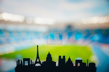 Foto de Paris Unveiled: Silhouette of the City 's Iconic Landmarks, Back dropped by a Modern Sports Stadium (en inglés). Una instantánea de los Juegos de Verano 2024 en París - Imagen libre de derechos