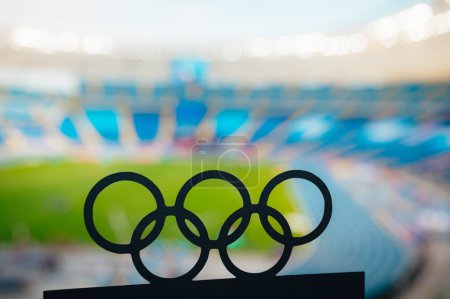 Photo for PARIS, FRANCE, JULY 7, 2023: Silhouette of Olympic Rings Against the Striking Backdrop of a Modern Olympic Stadium. Paris Summer Olympic Game 2024. - Royalty Free Image