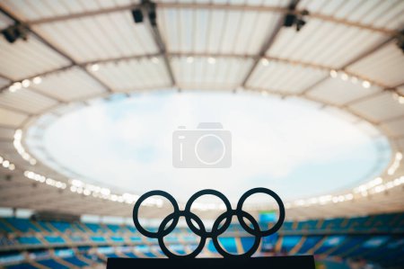 Photo for PARIS, FRANCE, JULY 7, 2023: Silhouette of Olympic Rings Reflecting on a Modern Olympic Stadium's Grandeur - Royalty Free Image