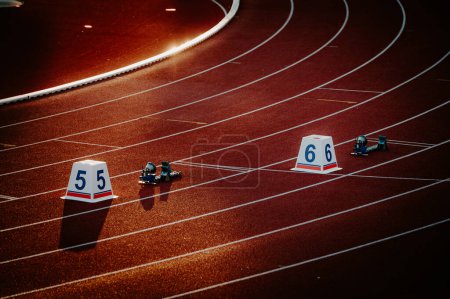 Photo for Starting numbers on athletics track. Professional Sprint race. Colorful photo for for Worlds in Budapest and Games in Paris - Royalty Free Image