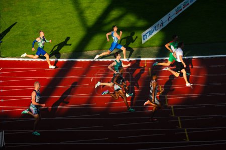 Photo for OSTRAVA, CZECHIA, JUNE 27, 2023: 400m Male Race in Bend Showcasing Play of Light and Shadow in Track and Field Venue for Worlds in Budapest and Summer olympic Games in Pari - Royalty Free Image