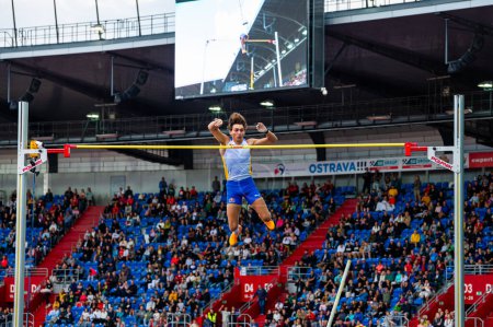 Photo for OSTRAVA, CZECHIA, JUNE 27, 2023: Armand Mondo Duplantis Clears Successful Pole Vault Jump: Track and Field Athletics Snapshot for Worlds in Budapest and Summer olympic Games in Paris - Royalty Free Image