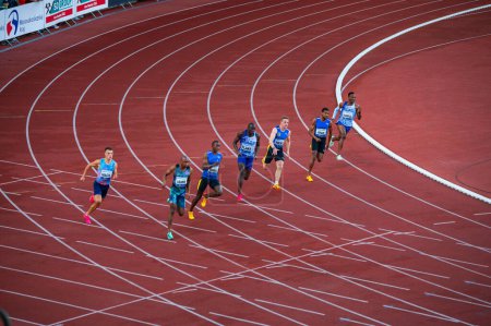 Photo for OSTRAVA, CZECHIA, JUNE 27, 2023: Focused Runners in Action: Men Participate in 200m Sprint at Track and Field Championship for Worlds in Budapest and Summer olympic Games in Paris - Royalty Free Image