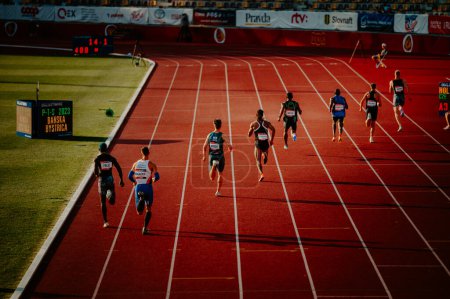 Photo for B. BYSTRICA, SLOVAKIA, JULY 20, 2023: Men Sprinters Push Limits in 400m Race Bathed in Serene Evening Ambiance on Track and Field Platform for Worlds in Budapest and Summer olympic Games in Paris - Royalty Free Image