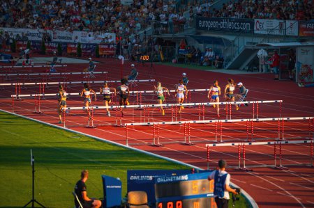 Photo for B. BYSTRICA, SLOVAKIA, JULY 20, 2023: Women Participate in 100m Hurdles Sprint at Track and Field Championship for Worlds in Budapest and Games in Paris - Royalty Free Image