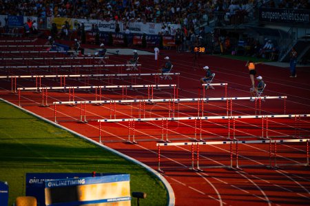 Photo for B. BYSTRICA, SLOVAKIA, JULY 20, 2023: Hurdles Set in Place Before Track and Field Event Commences for Worlds in Budapest and Games in Paris - Royalty Free Image
