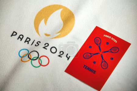 Photo for PARIS, FRANCE, JANUARY 4. 2024: Tennis pictogram for Paris 24 Games on white blanket with official logo of Summer olympic game in Paris 2024 - Royalty Free Image