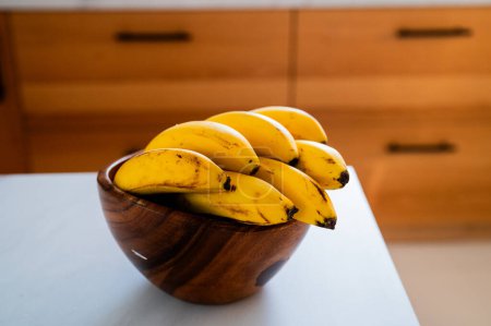 A sunlit kitchen moment: banana placed on the table