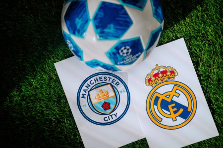 Photo for PARIS, FRANCE, MARCH. 16. 2024: Real Madrid (ESP) vs Manchester City (ENG). Quarter Finals of football UEFA Champions League 2024 in Europe. Logo of teams and official soccer ball on green grass - Royalty Free Image
