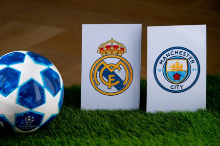 Photo for PARIS, FRANCE, MARCH. 16. 2024: Real Madrid (ESP) vs Manchester City (ENG). Quarter Finals of football UEFA Champions League 2024 in Europe. Logo of teams and official soccer ball on green grass - Royalty Free Image