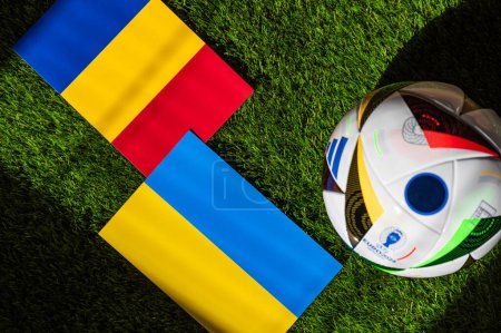 Photo for BERLIN, GERMANY, APRIL 17, 2024: Romania vs Ukraine, Euro 2024 Group E football match at Munich Football Arena, Munich, 17 June 2024, official ball on green grass - Royalty Free Image
