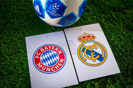 Photo for MUNICH, GERMANY, APRIL 28. 2024: Bayern Munich (GER) vs Real Madrid (ESP). Semifinals of football UEFA Champions League 2024 in Europe. Logo of teams and official soccer ball on green grass - Royalty Free Image
