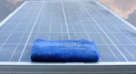 Photo for Solar panel cleaner Maintenance of solar panels or photovoltaic modules Sustainable resources and renewable energy for green ideas. solar energy for green energy Technology for the future. - Royalty Free Image