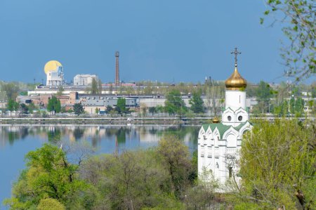 Photo for Church with golden domes and place religion of orthodox christian. Beautiful landscape with green park in middle of river. View of monastyrsky island with church of saint Nicholas in Dnipro Ukraine. - Royalty Free Image