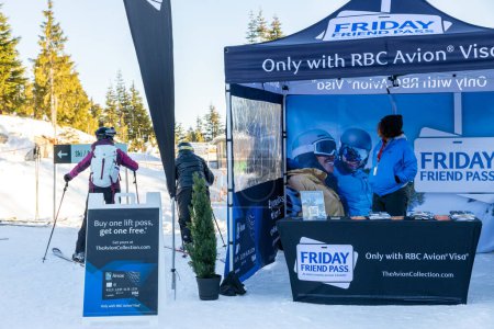 Téléchargez les photos : Vancouver, Canada - December 16,2022: A view of sign Friday Friend Pass by RBC Avion Visa at the Grouse Mountain Ski Resort - en image libre de droit