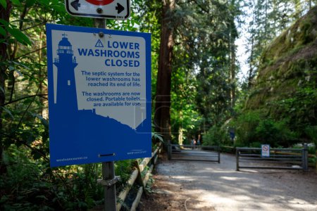 Photo for West Vancouver, Canada -May 20,2023: View of sign Lower Washrooms Closed inside Lighthouse Park in West Vancouver - Royalty Free Image
