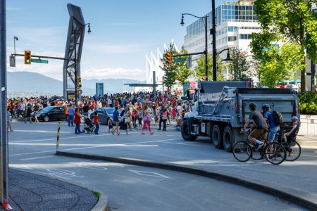 Photo for Crowds of people celebrating Canada Day in front of Canada Place in downtown Vancouver - Royalty Free Image