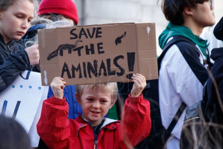 Photo for Vancouver, Canada - October 25,2019: A little boy with the sign Save the Animals as part of Climate Strike in front of Vancouver Art Gallery - Royalty Free Image