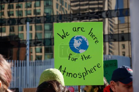 Photo for Vancouver, Canada - October 25,2019: A sign that reads 'We are here for the atmosphere' as part of the climate strike in Vancouver - Royalty Free Image