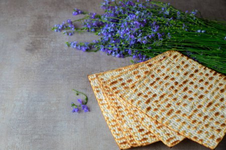 For Passover background, kosher matzoh with flowers.