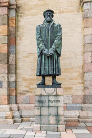 Photo for Ribe, Denmark - November 15, 2022: Statue Hans Tavsen Protestant theologian and reformer at cathedral of village Ribe In Southern Jutland in Denmark. Oldest city of Scandinavia - Royalty Free Image