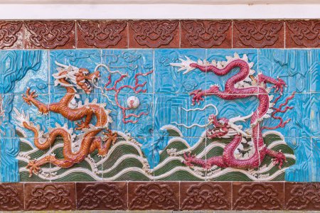 Photo for Haren, The Netherlands - April 5, 2023: Dragon tile wall in Chinese garden inspired by famous garden of Suzhou in Hortus Botanicus in Haren Municipality Groningen in Groningen province he Netherlands - Royalty Free Image
