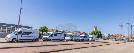 Photo for Terschelling, The Netherlands - June 10, 2023: Campers in line for the ferry to Harlingen at West-Terschelling in Friesland province in The Netherlands - Royalty Free Image