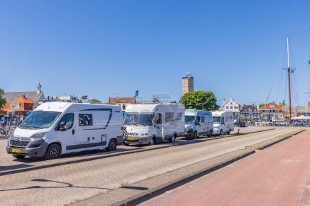 Photo for Terschelling, The Netherlands - June 10, 2023: Campers in line for the ferry to Harlingen at West-Terschelling in Friesland province in The Netherlands - Royalty Free Image