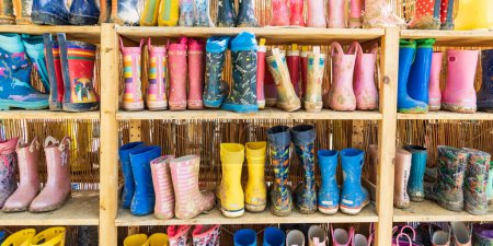 Photo for Colorful childeren rain boots from childcare at American Farm School in Thessaloniki Central Macedonia in Greece - Royalty Free Image