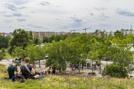 Photo for Berlin, Germany - July 23, 2023: People enjoying the view from the hill in Mauerpark in Berlins Prenzlauer Berg district in Berlin in Germany. - Royalty Free Image