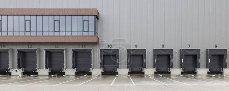 Photo for Row of gray loading docks of a warehouse or distbution center - Royalty Free Image