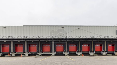 Photo for Row of red loading docks of a warehouse or distbution center - Royalty Free Image
