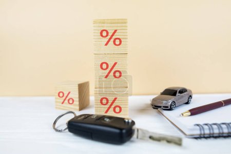 Photo for Car with keys and documents, wooden cubes with a percentage sign. car loan concept, saving money for car concept - Royalty Free Image