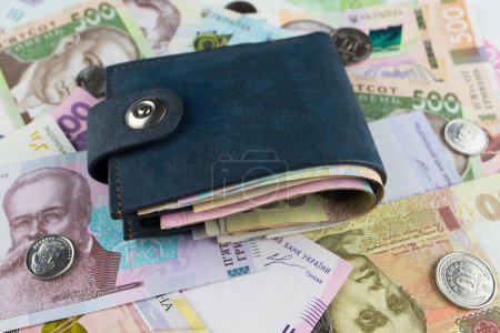 Wallet with hryvnia. Ukrainian money. Financial concept.