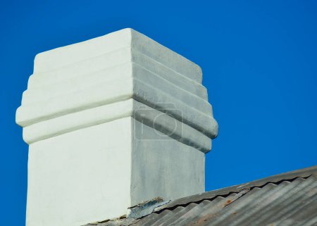 Photo for A view of a white chimney on an old house in the countryside - Royalty Free Image