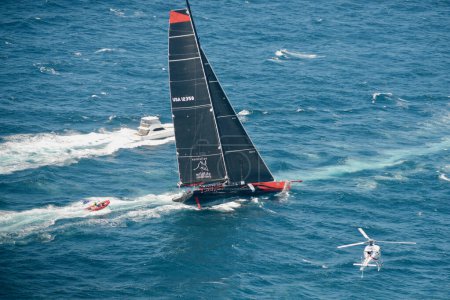 Photo for Sydney to Hobart Yacht Race 2014 - Comanche races out of Sydney Harbor - Royalty Free Image