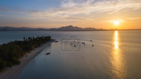 Aerial view of koh Mook or koh Muk island with beautiful sky and sunrise, in Trang, Thailand. It is a small idyllic island in the Andaman Sea in the south of Thailand.