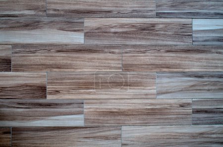 Photo for Light cladding tiles imitating wood on wall closeu - Royalty Free Image