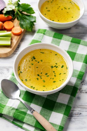 Photo for Chicken broth, stock or bouillon with vegetables - Royalty Free Image
