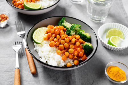 Photo for Chickpea curry with basmati rice and broccoli on gray background - Royalty Free Image