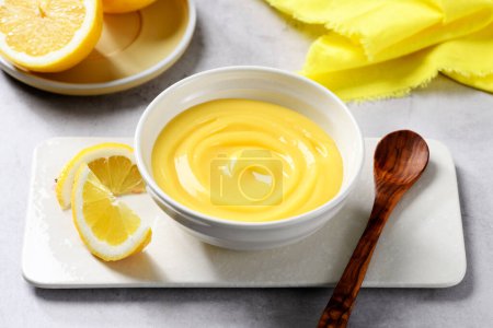 Photo for Homemade vanilla custard pudding or lemon curd in a white bowl. - Royalty Free Image