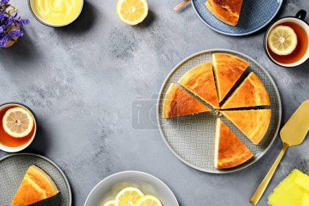 Photo for Fresh baked homemade lemon cheesecake with lemon curd and lemon slices. top view - Royalty Free Image