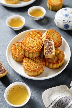 Photo for Traditional Chinese  dessert. Homemade baked mooncakes filled with nuts and dried fruits, Chinese Mid-Autumn Festival food. - Royalty Free Image