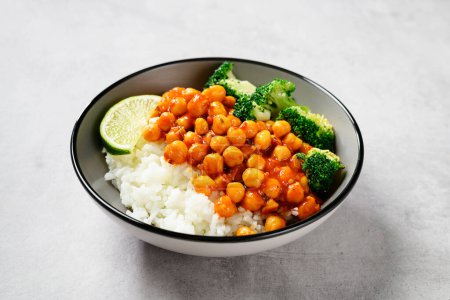 Photo for Chickpea curry with basmati rice and broccoli on gray background, - Royalty Free Image