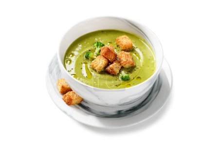 Photo for Bowl of fresh broccoli cream soup with croutons isolated on white background - Royalty Free Image