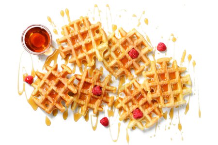 Photo for Freshly baked belgian waffle with fresh raspberry and maple syrup isolated on white background. top view - Royalty Free Image