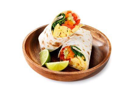 Photo for Homemade breakfast egg burrito with fresh vegetables and different sauces for healthy vegetarian breakfast. - Royalty Free Image