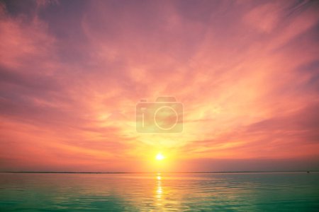 Photo for Seascape in the evening. Beautiful majestic sunset over the calm sea. Beautiful sky over the sea - Royalty Free Image