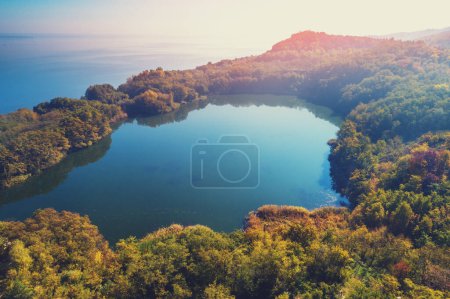 Picturesque mountain lake in autumn. Lake against the sea. Beautiful wilderness. Aerial view